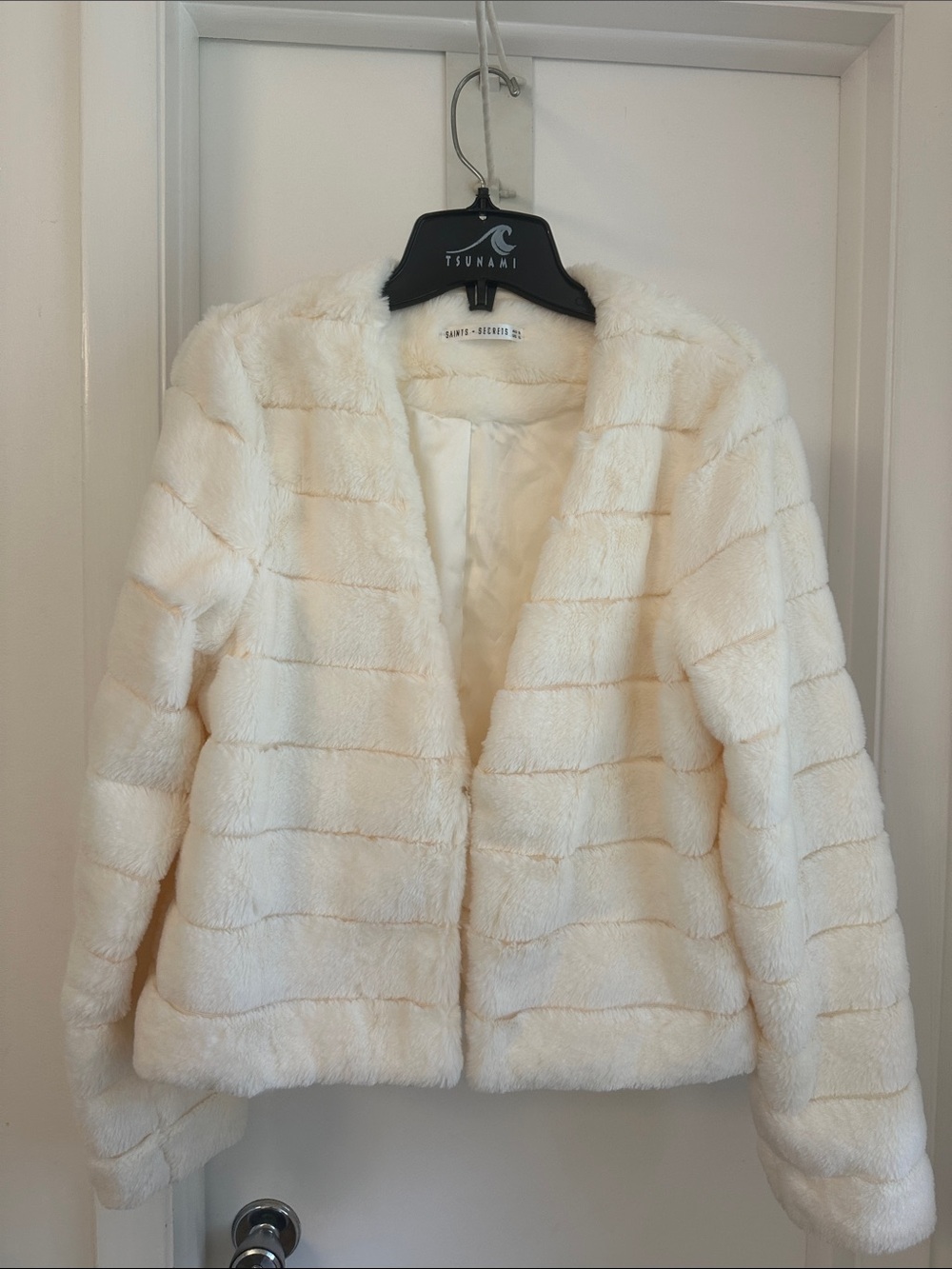 Cream Faux Fur Teddy Jacket by Saints and Secrets. Front closure is hook and eye